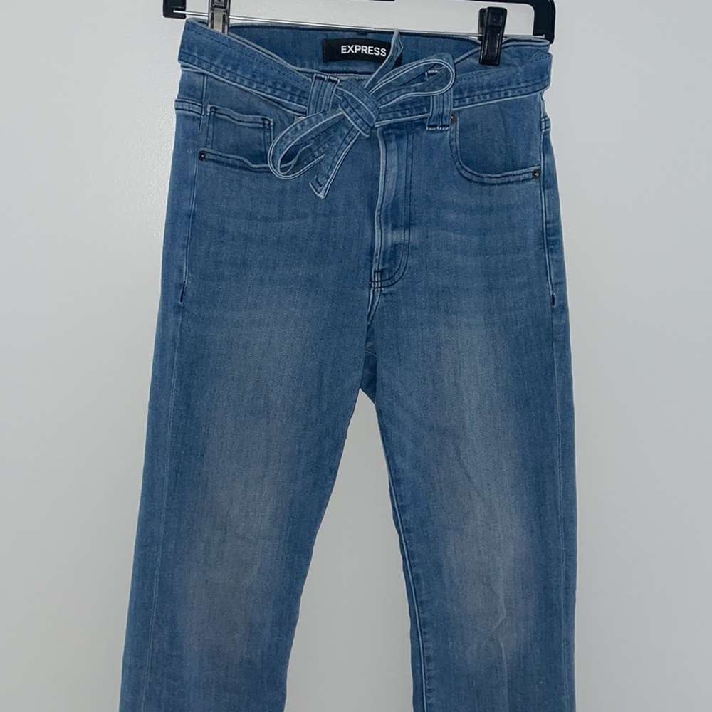 Express flare jeans with a accent tie around the waste